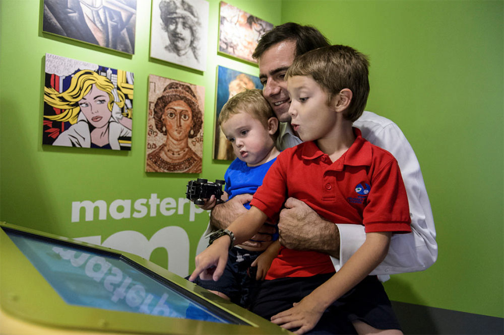Father with two kids enjoying themselves at Miami Children's Museum