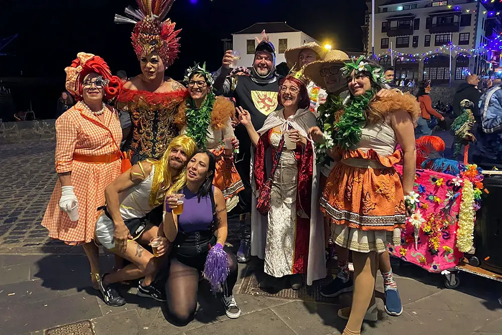 Locals celebrating the 2023 Carnival outside La Fragata in the harbour, Puerto de la Cruz, Tenerife.