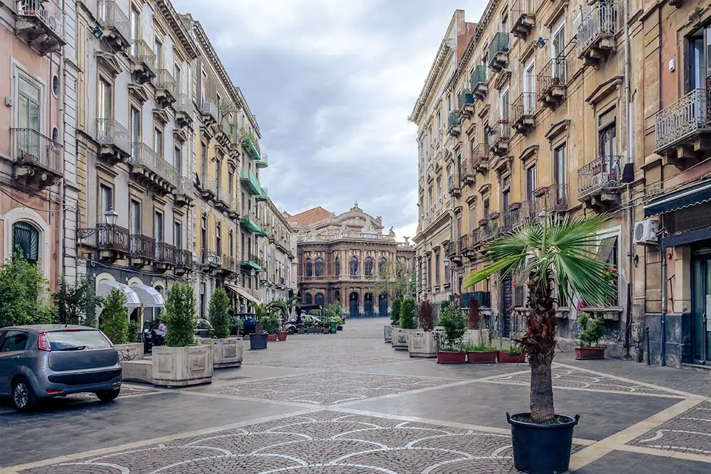 Street of Catania with the famous Opera Theatre Teatro Bellini in the background.